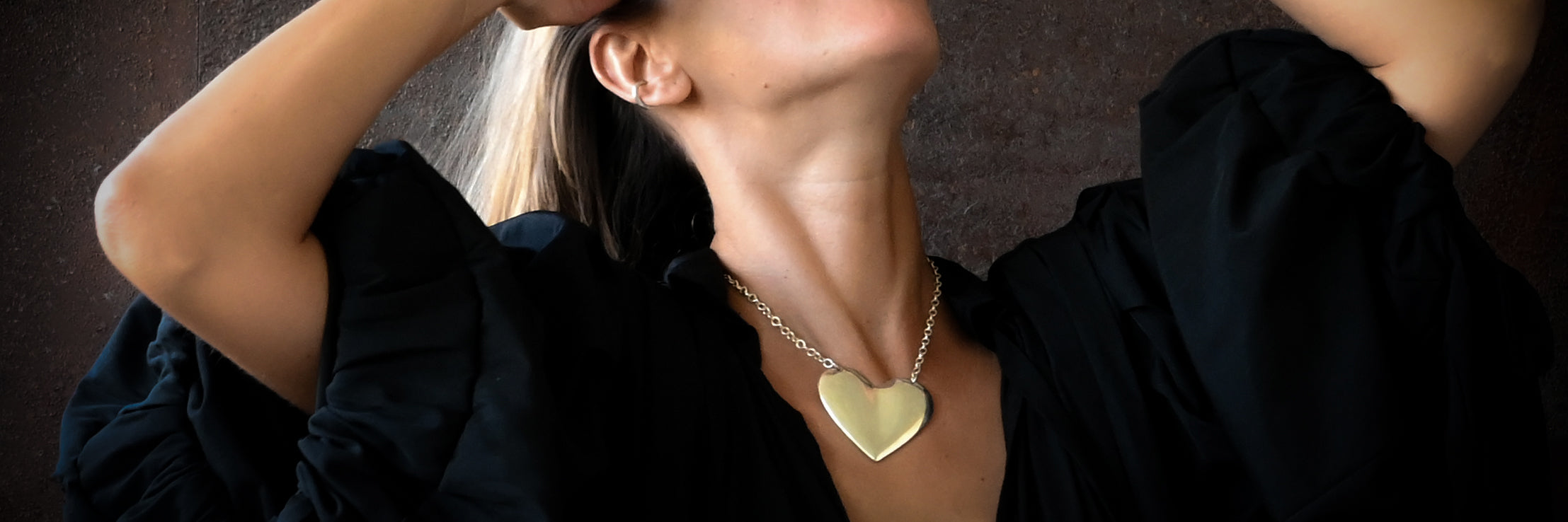 hand carved silver heart pendant necklace worn around the neck