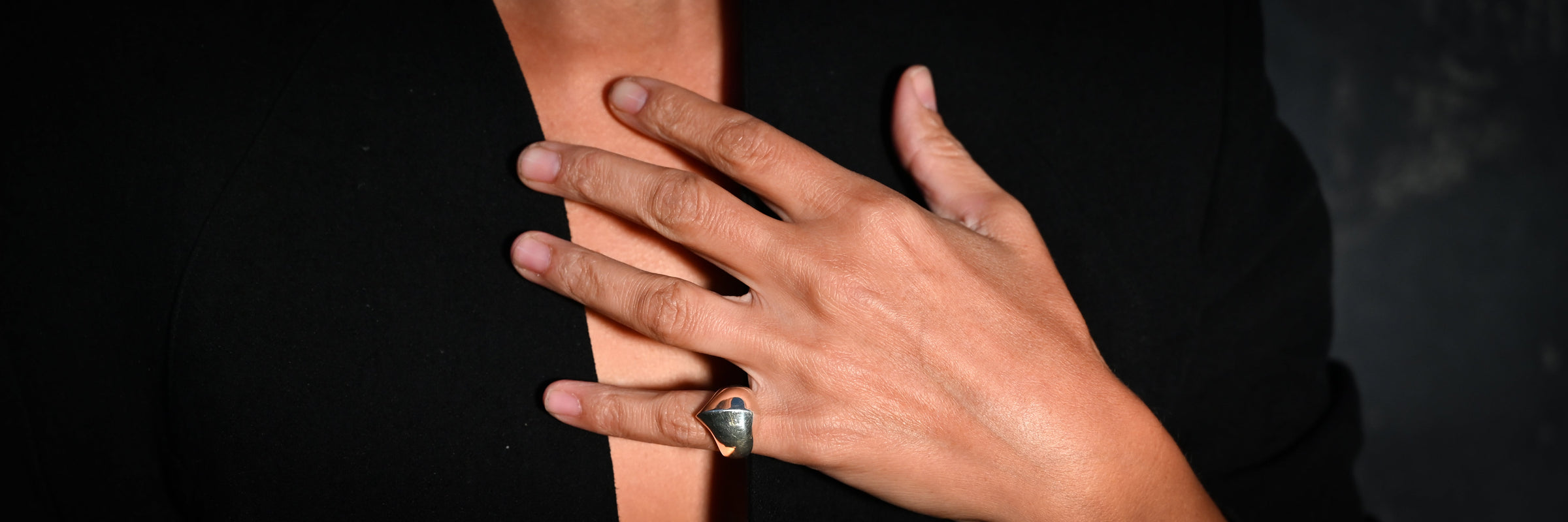 sterling silver sculptural kiss pinky signet ring on hand - Jovana Djuric New York
