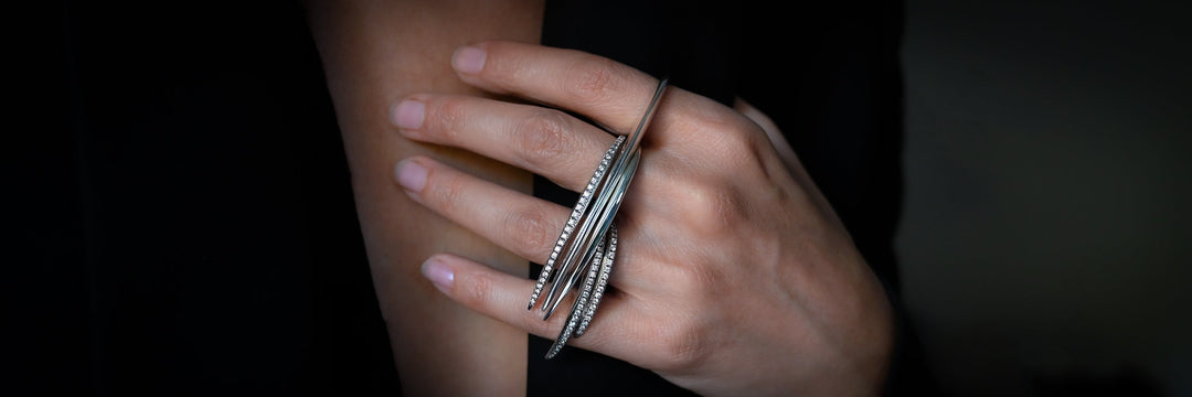 Sterling silver slice rings in solid and with Diamonds pave ridge worn together over multiple fingers - Jovana Djuric New York