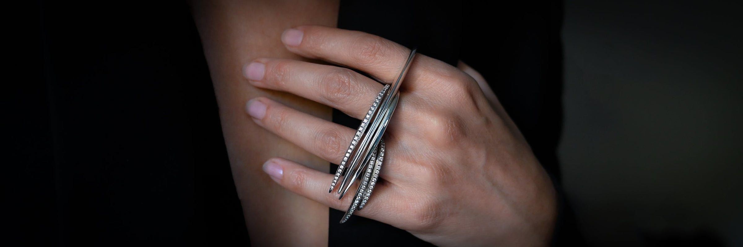 Sterling silver slice rings in solid and with Diamonds pave ridge worn together over multiple fingers - Jovana Djuric New York