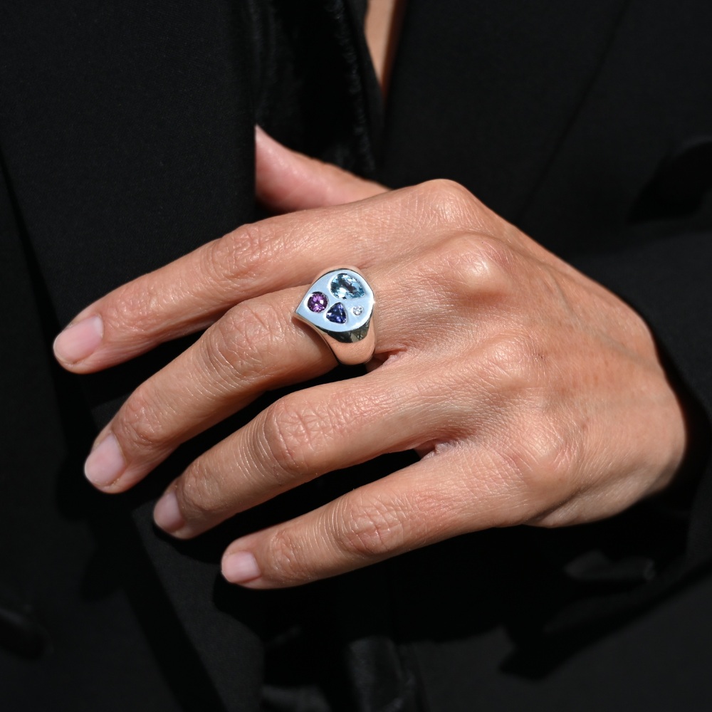 Silver ring with flat top and playfully placed semi precious stones